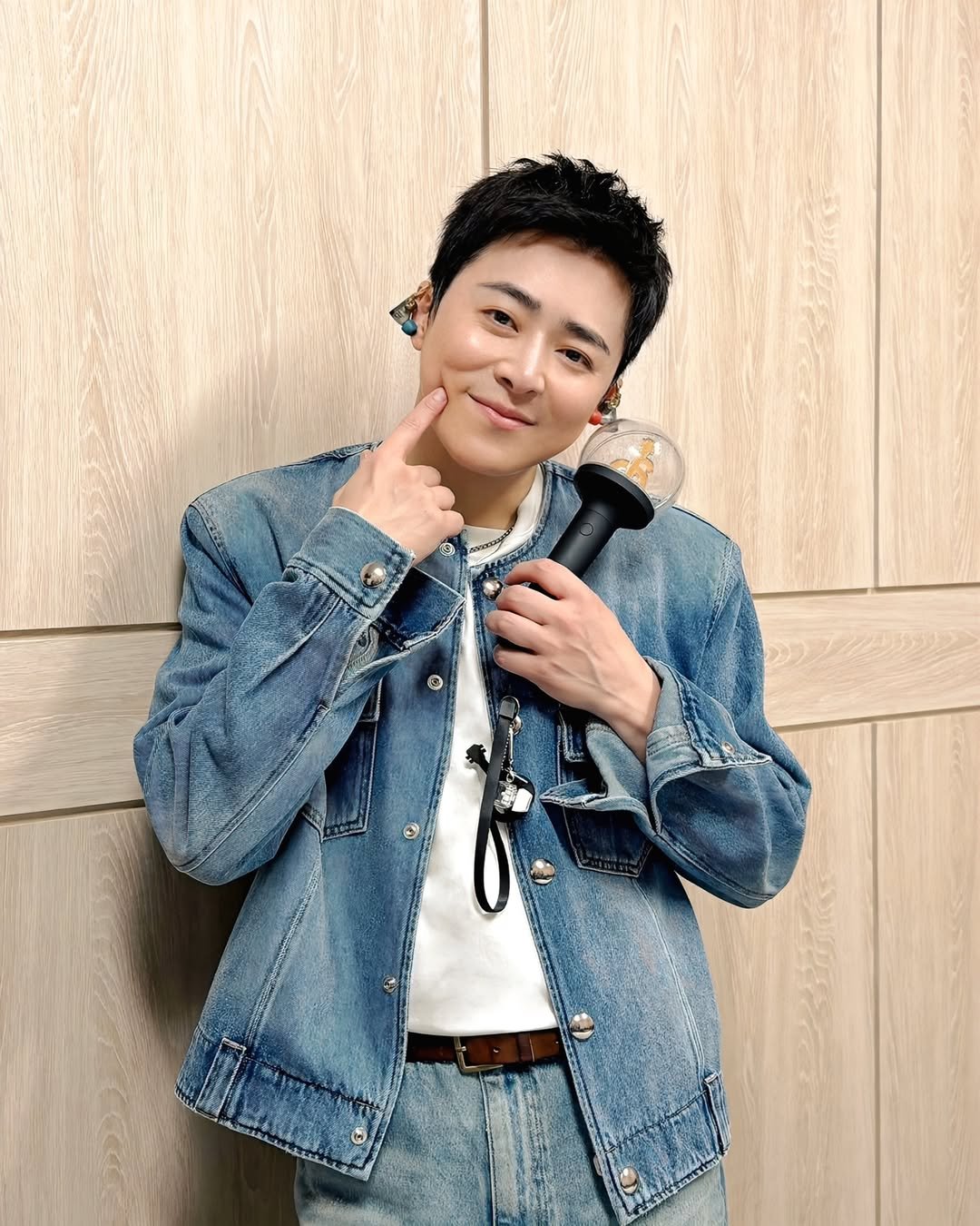 Photo by 조정석 CHO JUNG SEOK on January 04, 2026. May be an image of microphone, bolo tie and text.