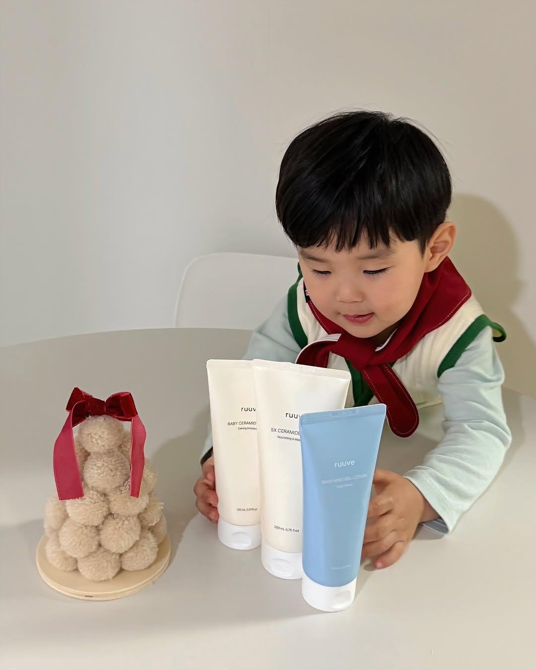 Photo shared by 이츄맘💖 on December 27, 2025 tagging @ruuve.official. May be an image of child, hair product, hand cream, lotion and text.