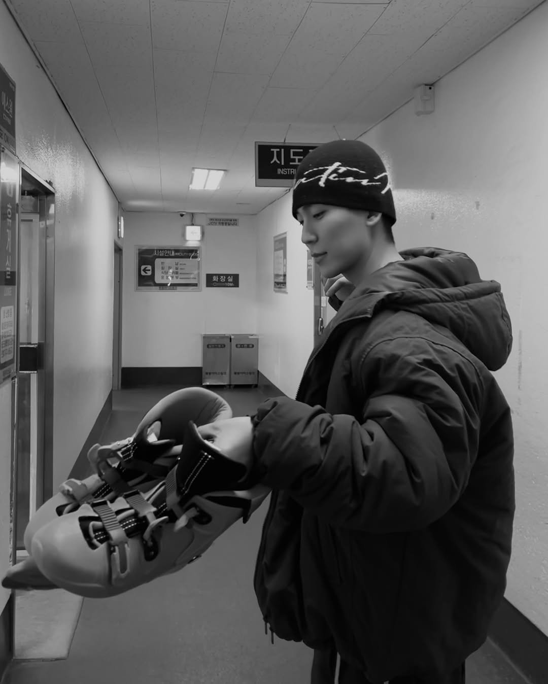 Photo by 김정철 on December 24, 2025. May be a black-and-white image of parka, punching bag and text.