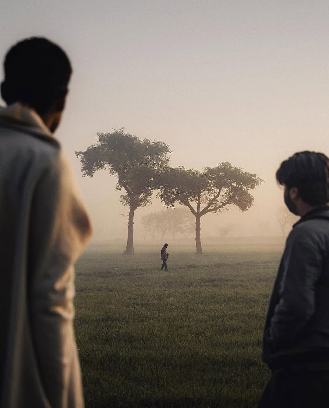 Photo shared by CINEGRAMS on November 22, 2025 tagging @khumaix. May be an image of one or more people, fog, park and text.