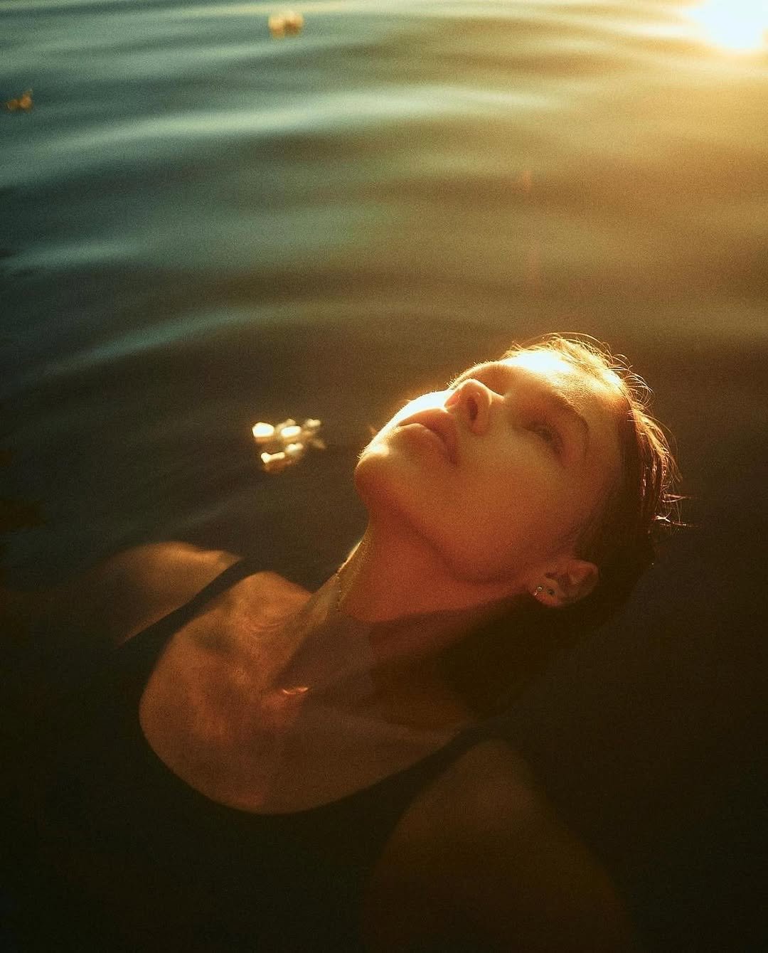 Photo shared by CINEGRAMS on December 31, 2025 tagging @xenia.visions. May be an image of swimming, lake and text.