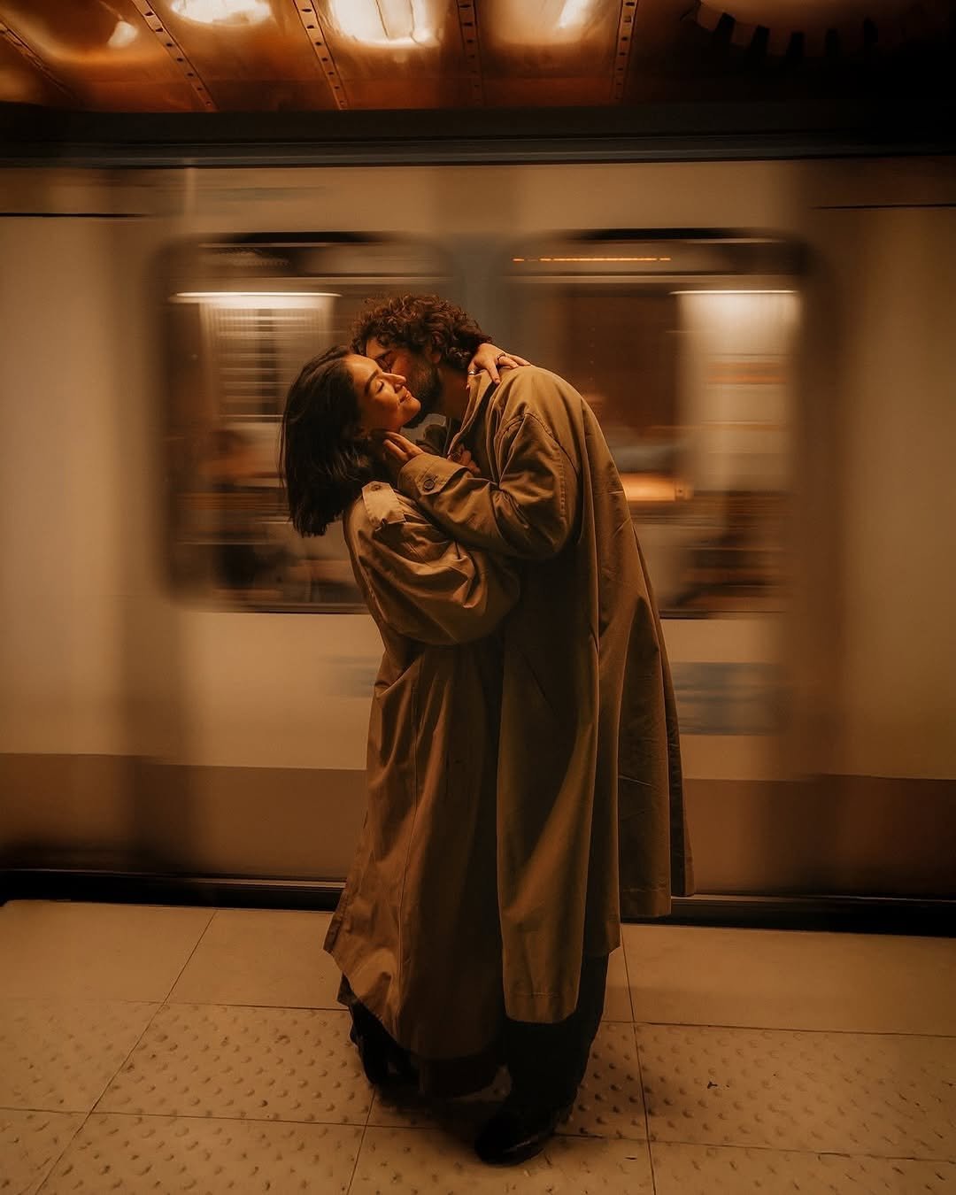Photo shared by CINEGRAMS on December 29, 2025 tagging @melcolephoto. May be an image of one or more people, people kissing, overcoat and text.