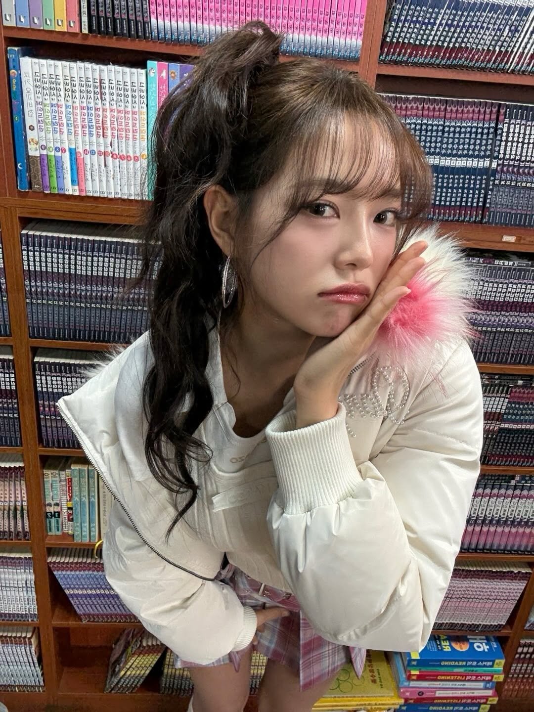 Photo by 김세정 on December 25, 2025. May be an image of one or more people, braids, parka and text.