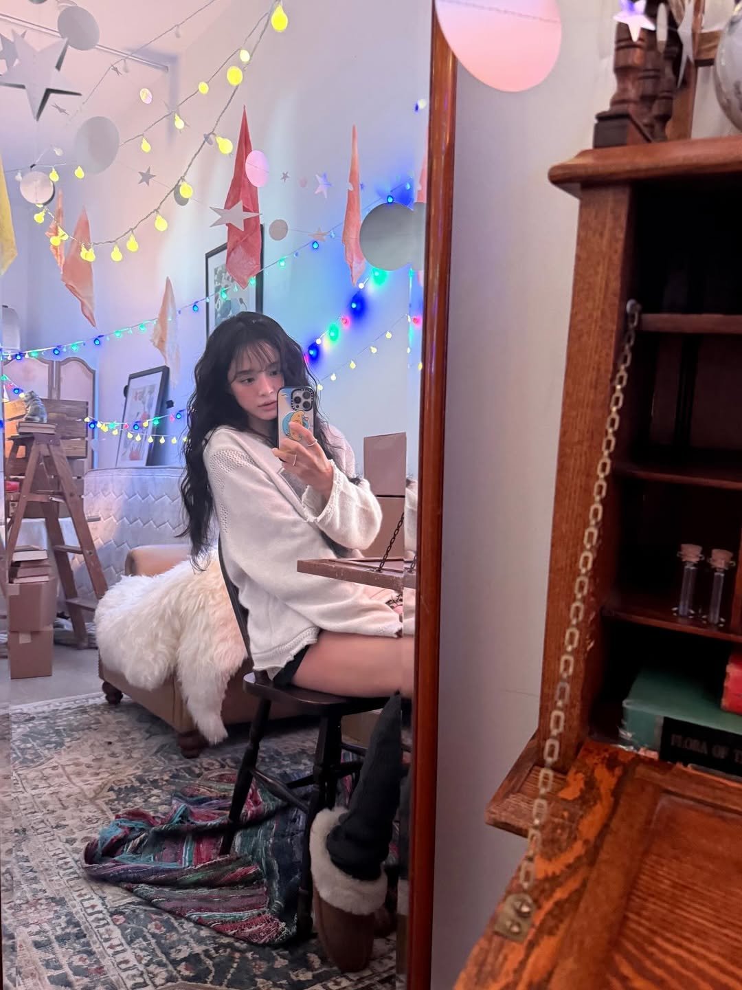 Photo by 김세정 on December 16, 2025. May be an image of sleepwear, bath robe, beanbag chair, bedroom and text.