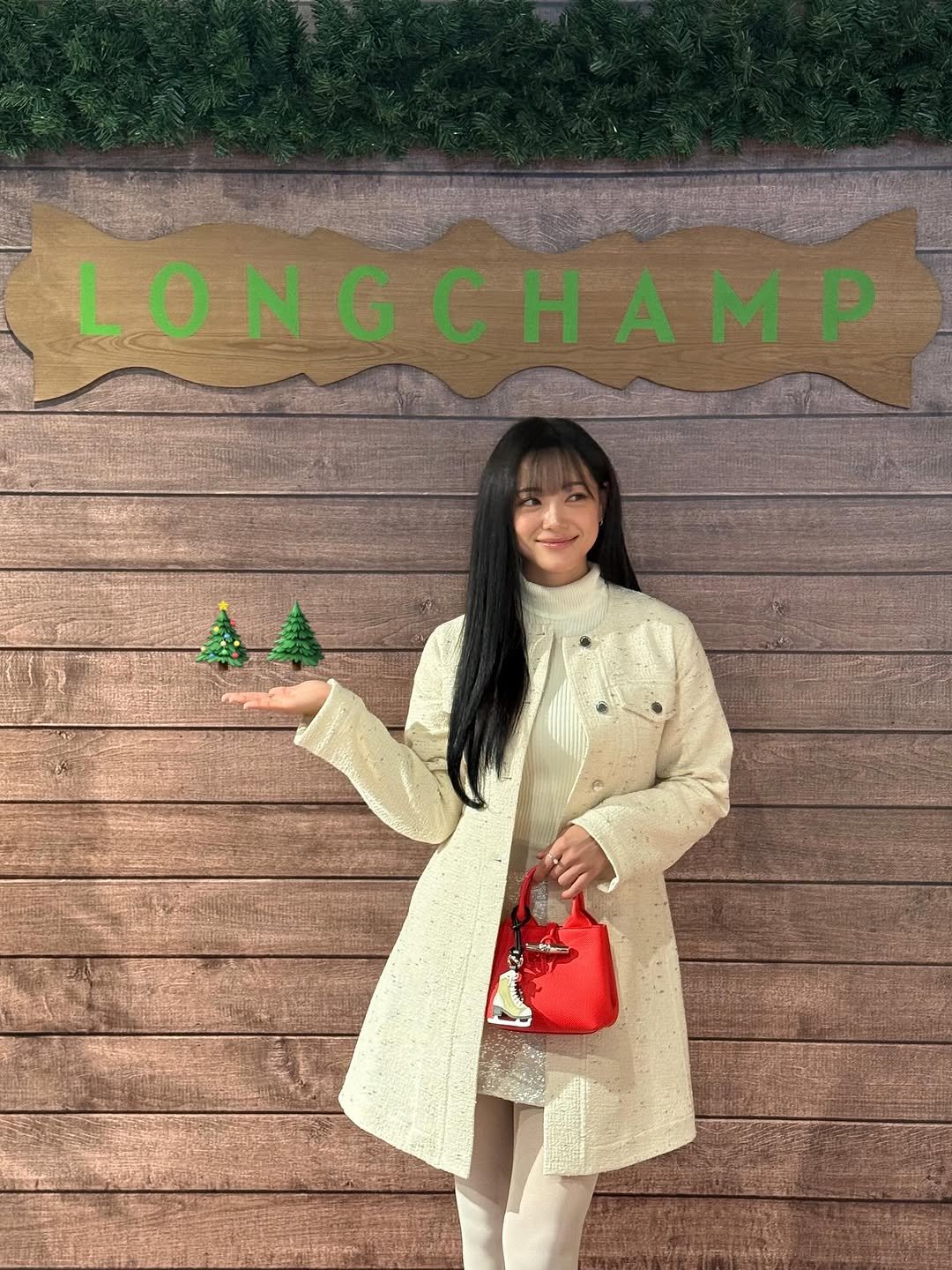 Photo shared by 김세정 on November 11, 2025 tagging @longchamp. May be an image of overcoat, duffle coat, fur coat, beret, turtleneck and text.