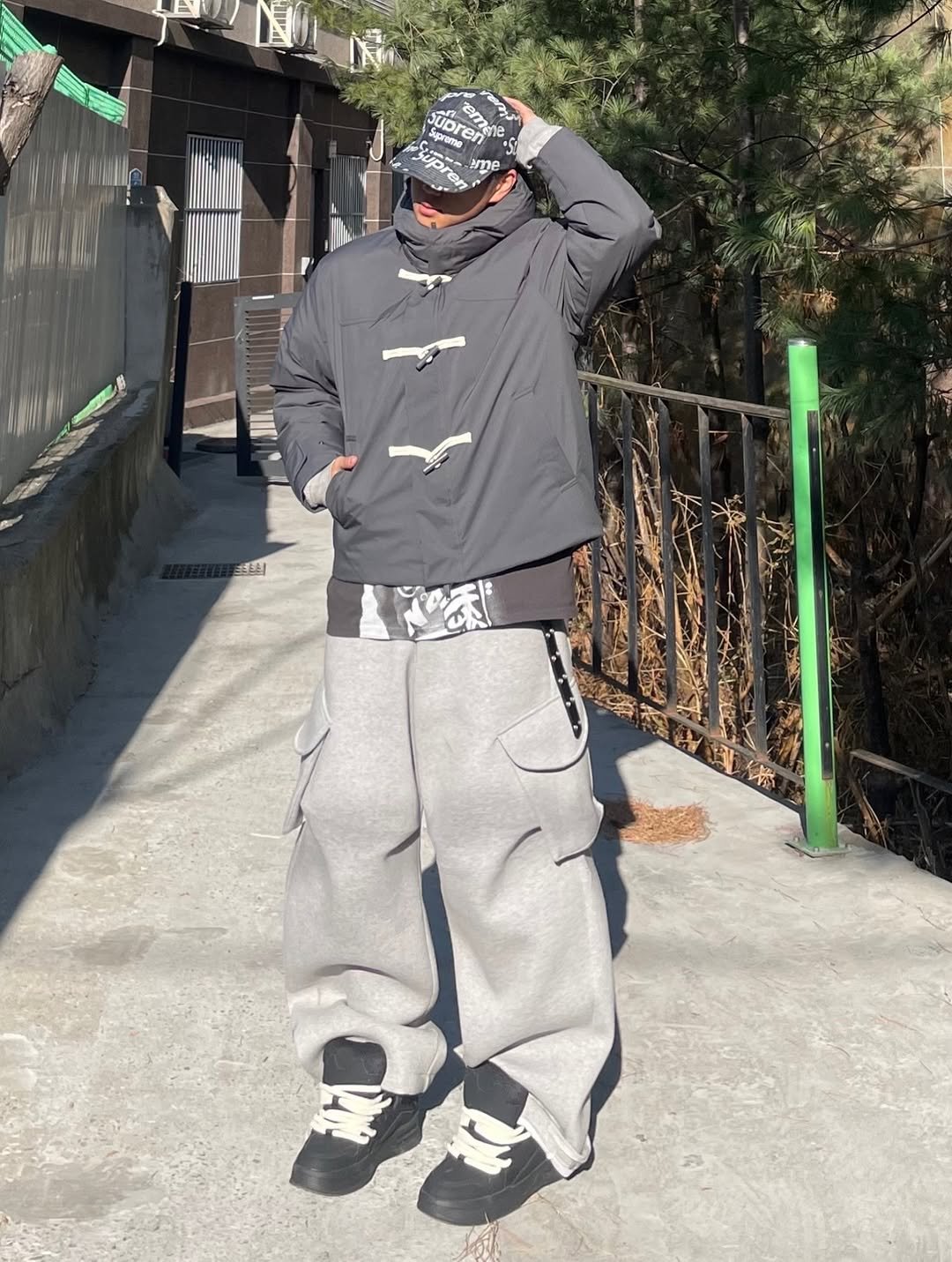 Photo shared by 정인 on January 16, 2026 tagging @brandsalon_office, and @ucla_lifestyle_korea. May be an image of ‎duffle coat, face mask, sweatsuit, parka, bandanna, sweatpants and ‎text that says '‎& emee ao আ UDE soprame Suprome subren חון သ ome‎'‎‎.