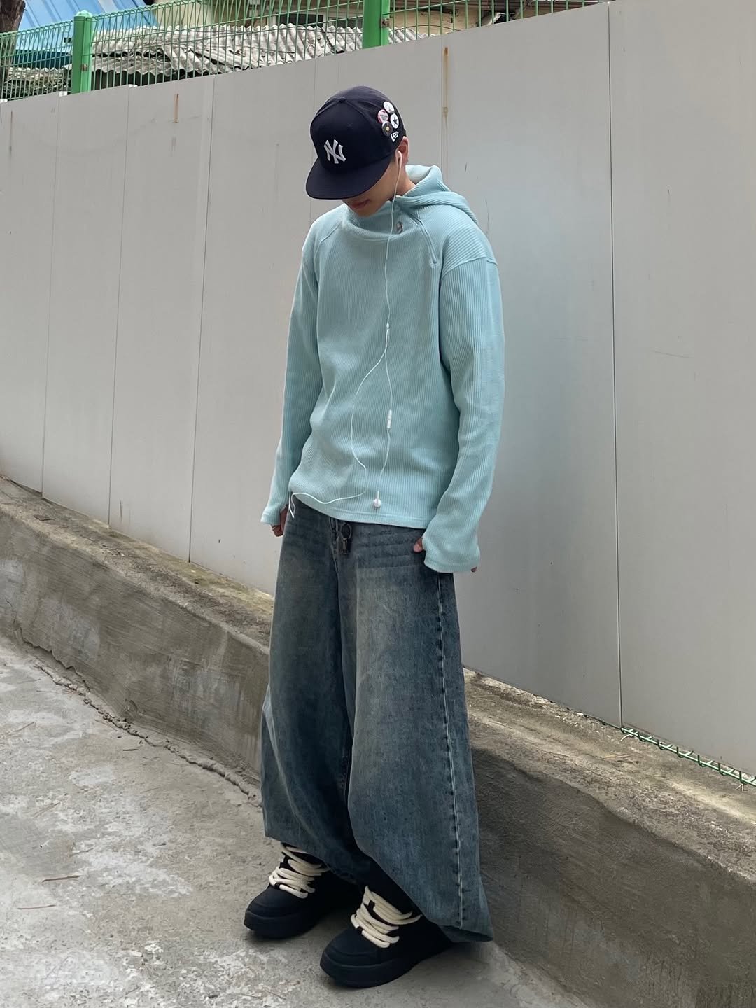 Photo shared by 정인 on December 23, 2025 tagging @newerakorea, @zara, @kichul.official, and @dsmt.official. May be an image of hat, sweatpants and text.