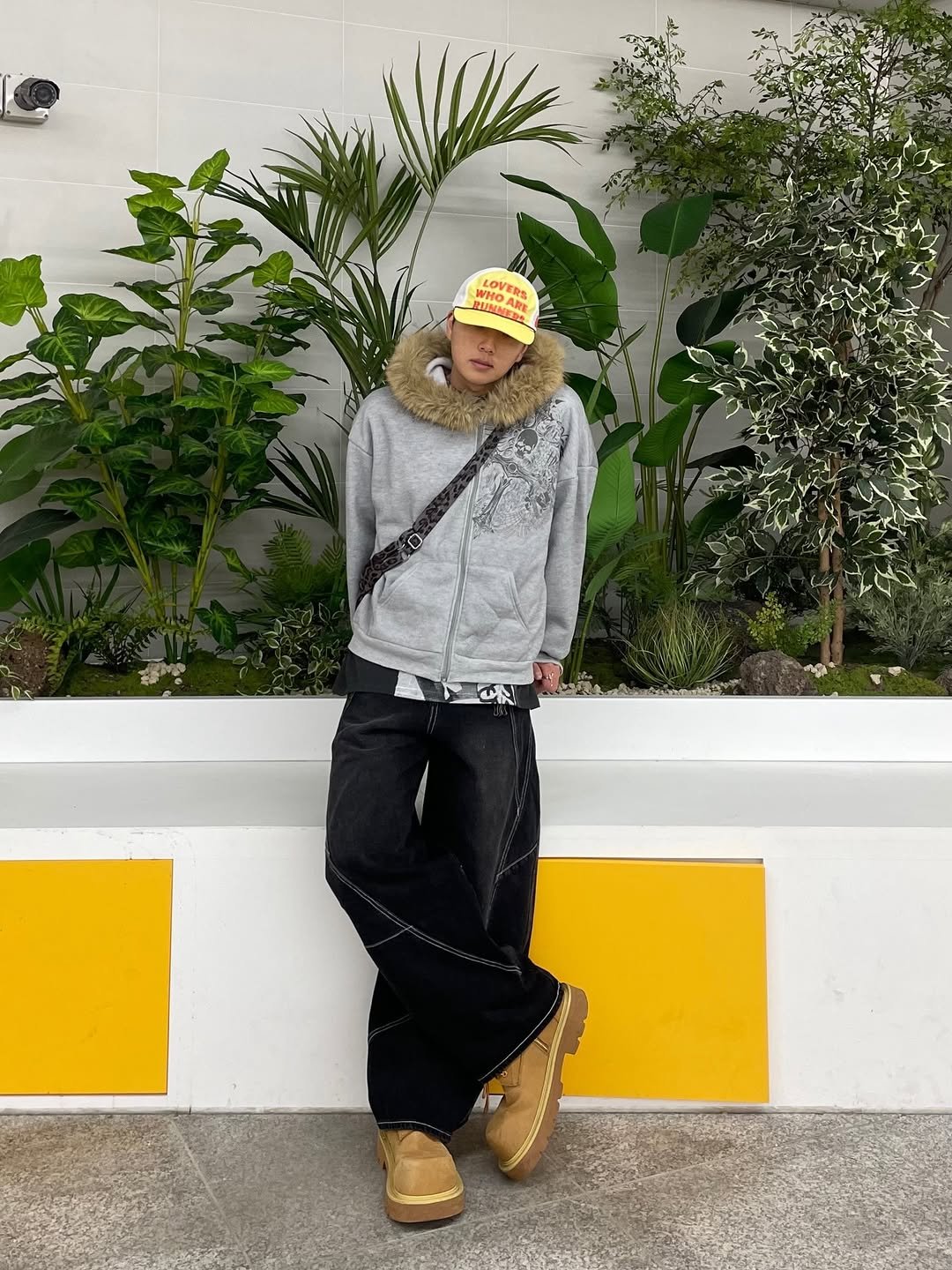 Photo shared by 정인 on January 27, 2026 tagging @juan_lofficiel. May be an image of duffle coat, goosedown coat, fur, parka, sweatpants and text.