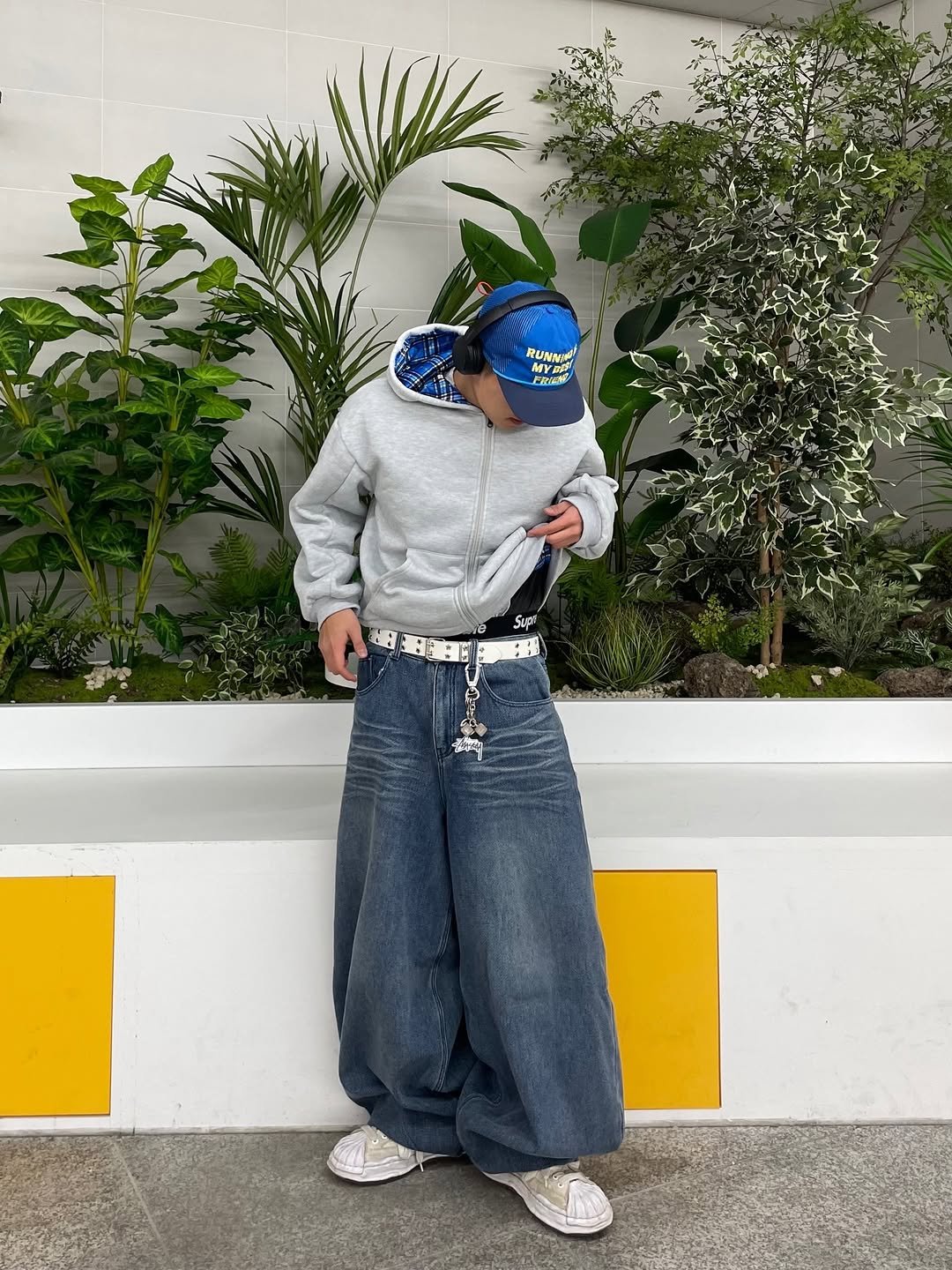 Photo shared by 정인 on February 12, 2026 tagging @alexzono. May be an image of headscarf, face mask, sweatpants, bandanna and text.