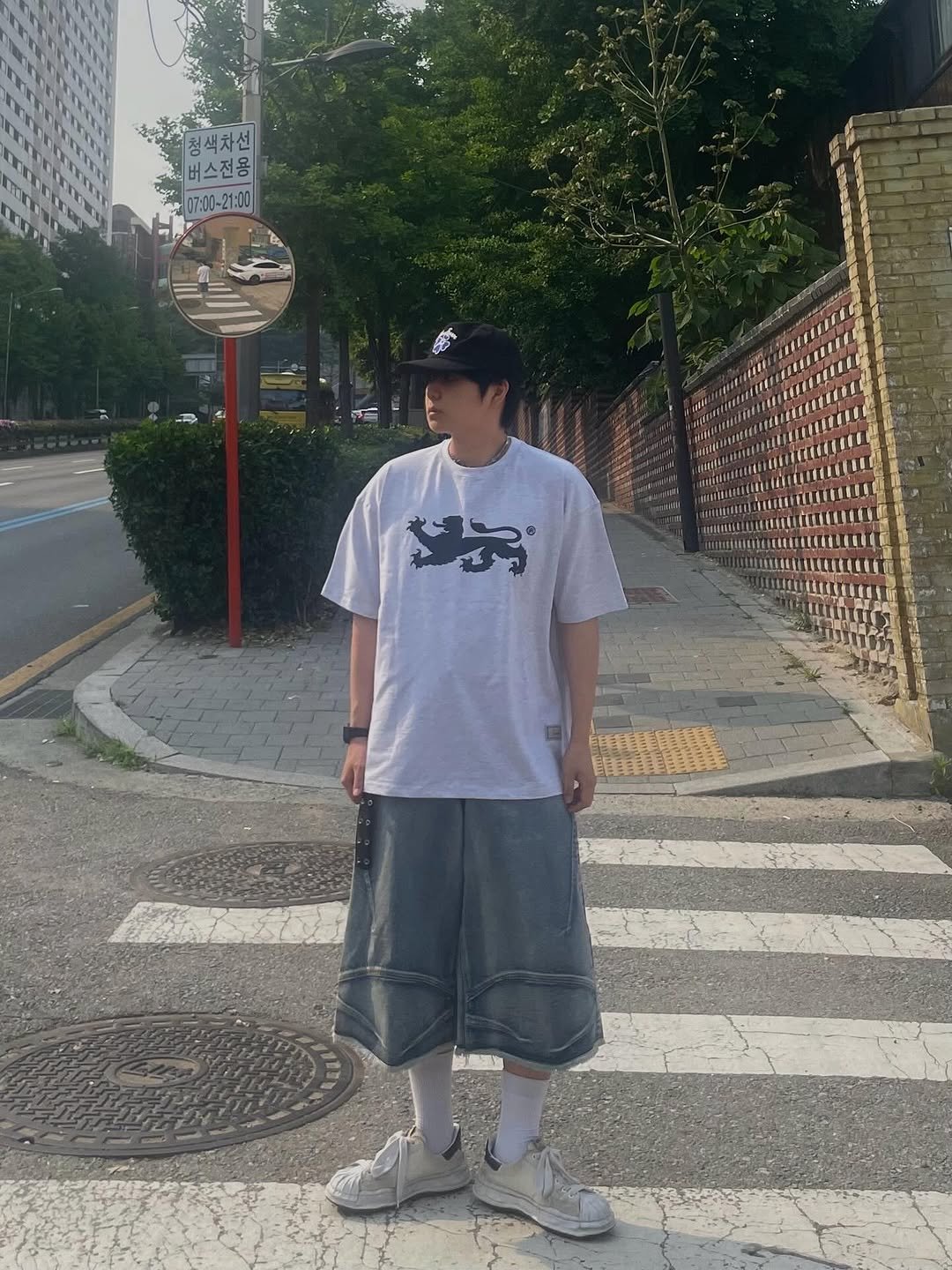 Photo shared by Ol정인 on June 01, 2025 tagging @aambition_official. May be an image of hat, shorts, sweatpants and street.