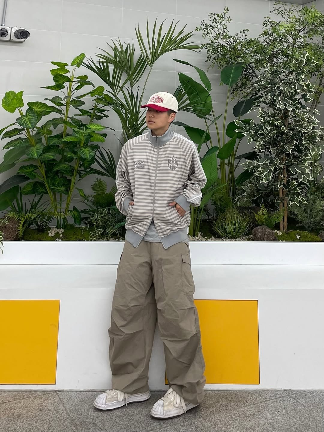 Photo shared by 정인 on April 05, 2026 tagging @travel_liveincomfort. May be an image of duffle coat, hat, parka, sweatpants and text.