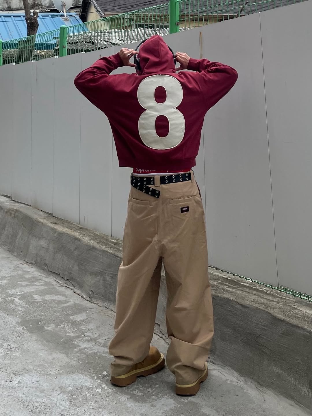 Photo shared by 정인 on December 31, 2025 tagging @de_nage_. May be an image of duffle coat, turtleneck, sportswear, parka and text.