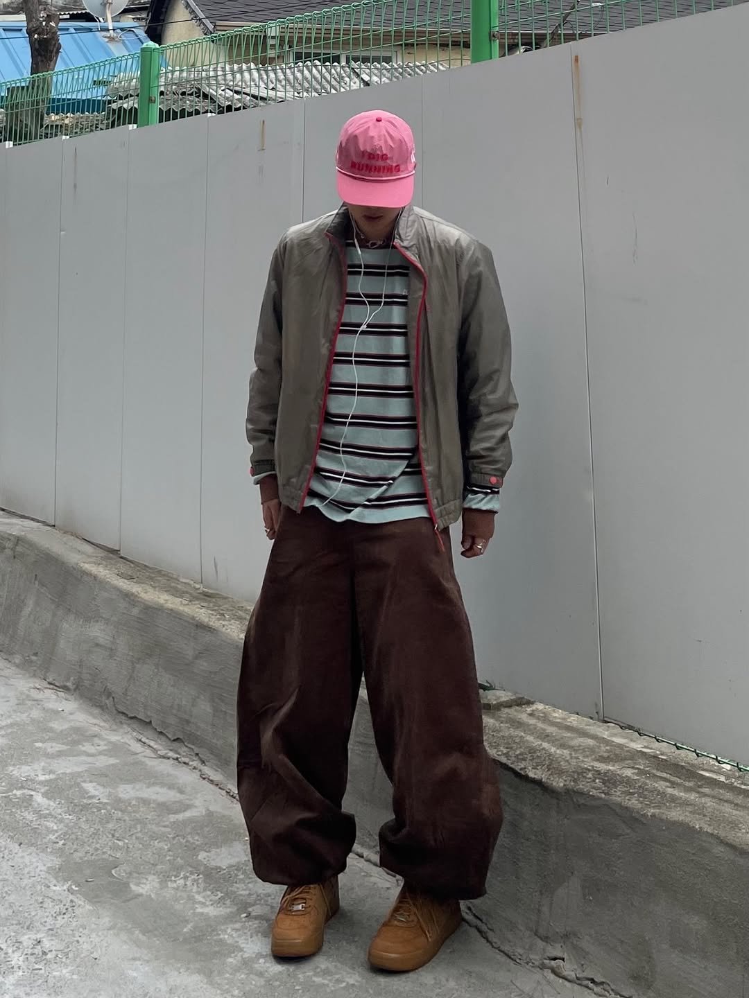 Photo shared by 정인 on December 27, 2025 tagging @kichul.official. May be an image of wingtip shoes, duffle coat, hat, jacket, sweatpants, parka and text.