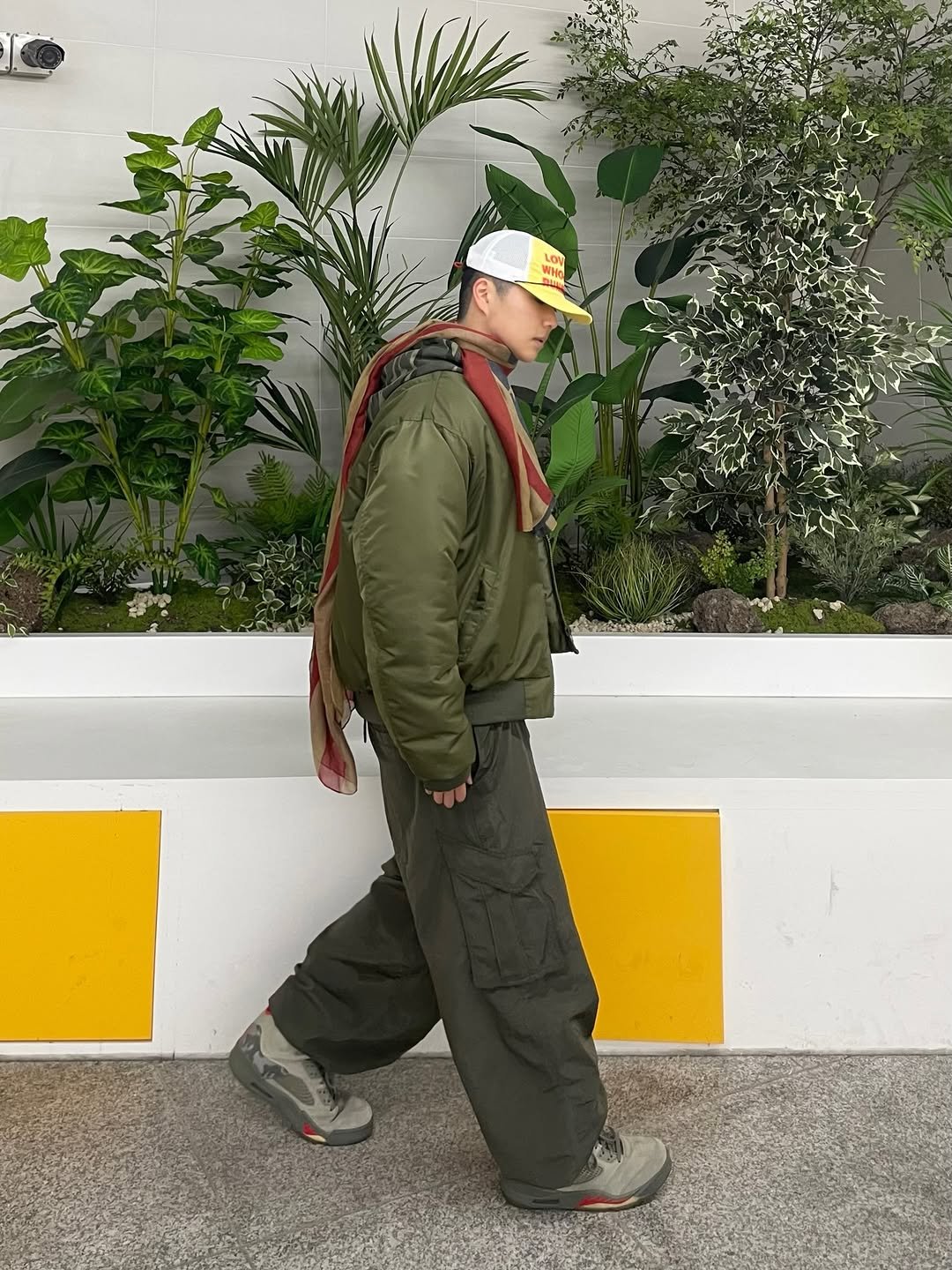 Photo shared by 정인 on February 14, 2026 tagging @aeca_official. May be an image of hat, headscarf, military uniform, turban, beret, parka and text.