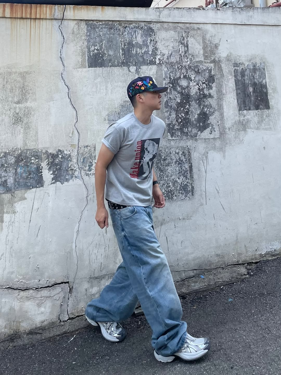 Photo shared by 정인 on April 20, 2026 tagging @amou.co.kr. May be an image of sweatpants, street and text.