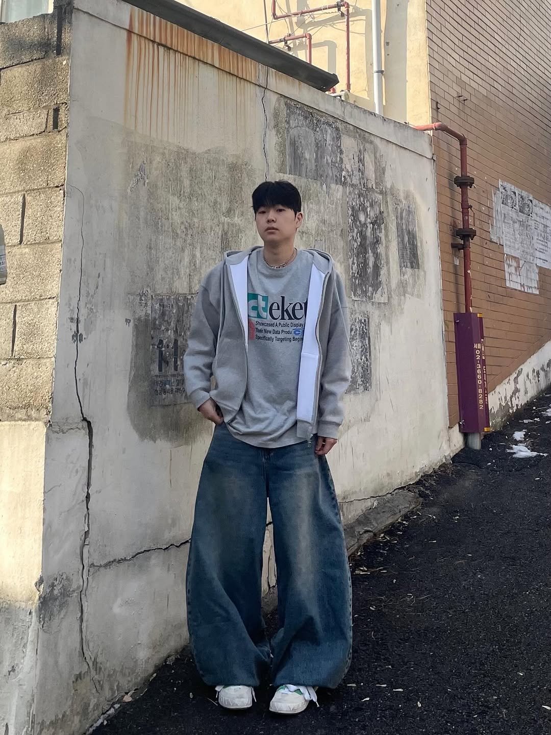 Photo by Ol정인 on July 11, 2025. May be an image of 1 person, outerwear, sweatpants and text.