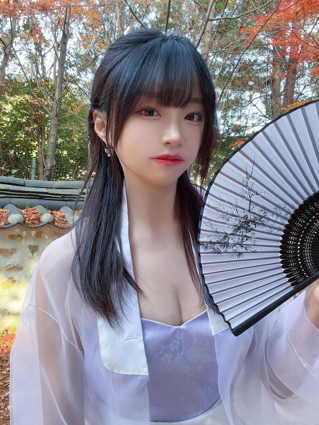 Photo by 코코 김아영 coco on February 16, 2026. May be an image of one or more people, hair, bath robe, parasol and text.