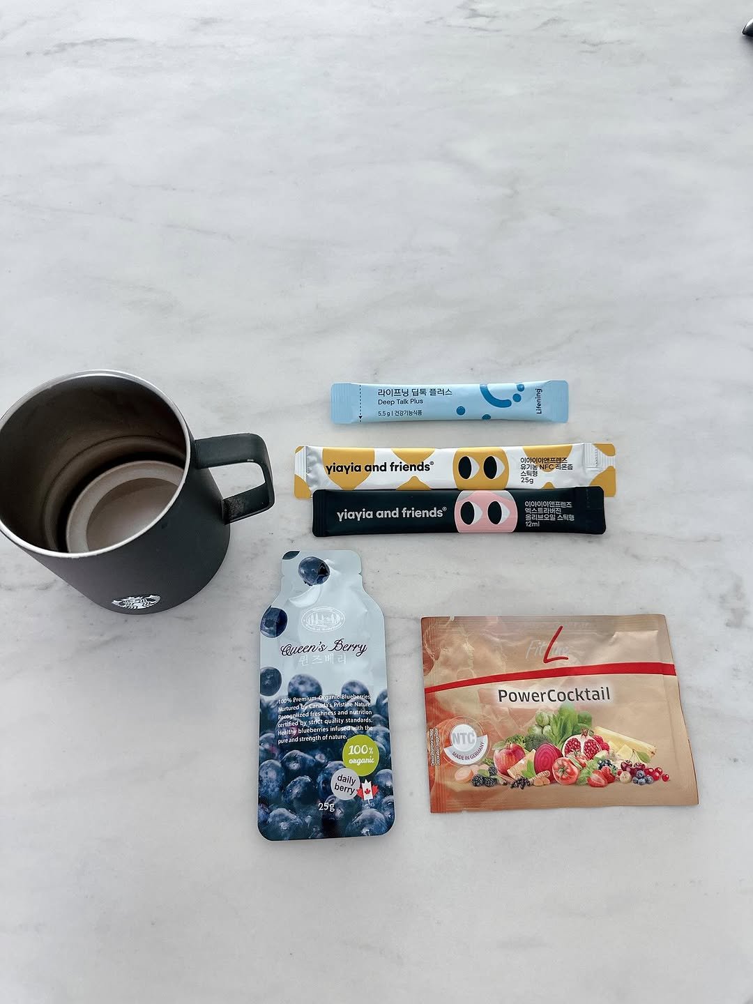 Photo by 코코블랙  권영주 on August 10, 2025. May be an image of coffee cup, phone, tea, mouse pad, hand cream, pencil case, clipboard, cornflower and text.