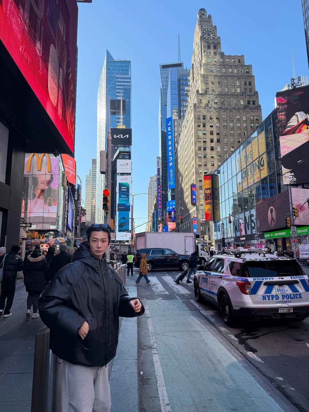 Photo by 채형원 hyungwon on December 25, 2025. May be an image of standing, Times Square and text.