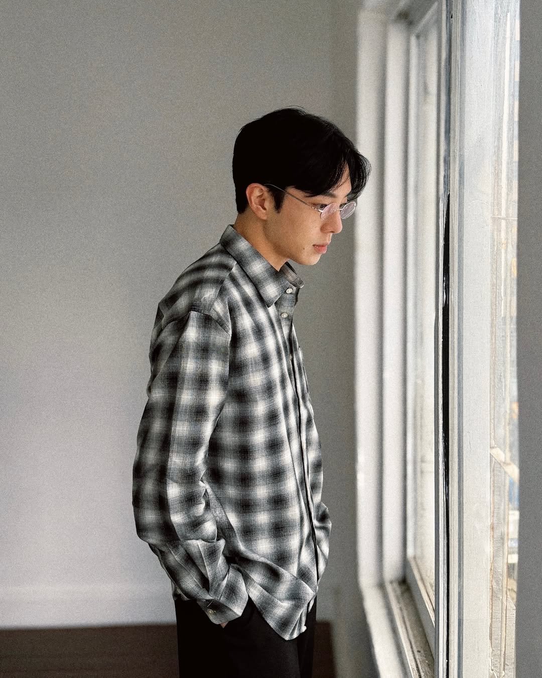 Photo by 컨셉원 concepts1one on December 30, 2025. May be an image of one or more people, duffle coat, bolo tie and text.