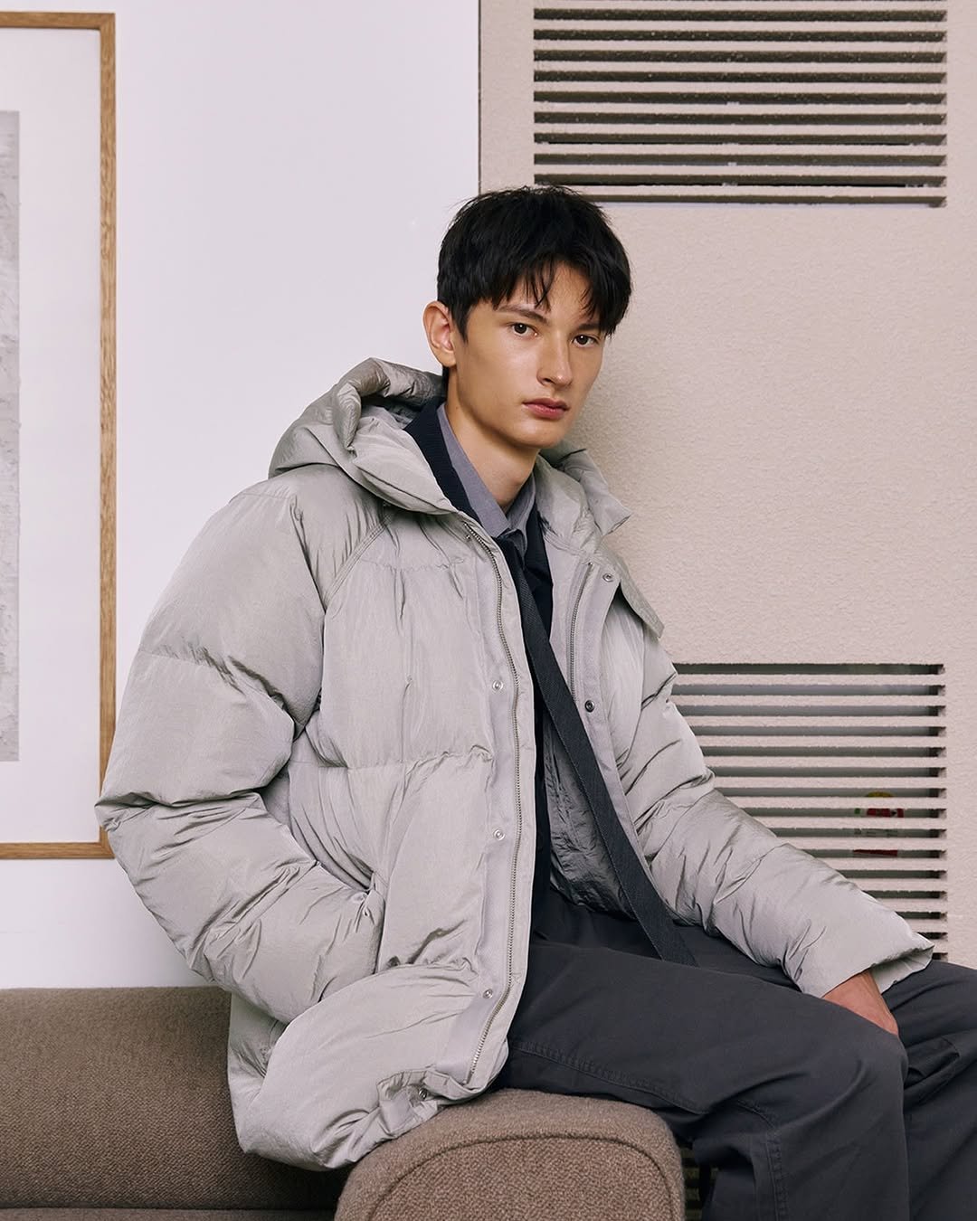 Photo by 컨셉원 concepts1one on November 10, 2025. May be an image of duffle coat, overcoat, goosedown coat, fur coat, jacket, parka and text.