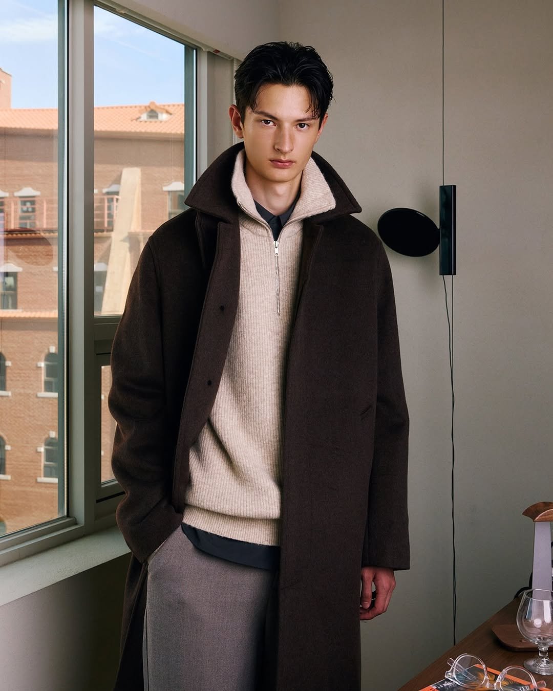 Photo by 컨셉원 concepts1one on November 13, 2025. May be an image of duffle coat, goosedown coat, overcoat, fleece and text.