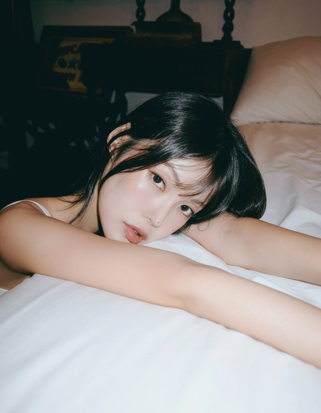 Photo shared by 외양간 스튜디오 | 홍대사진관 · 커플사진 · 커플스냅· 프로필사진 · 홍대증명사진 on August 14, 2025 tagging @_iamriveraa. May be an image of 1 person, hair, sleepwear, slip, bed, bedroom and text.