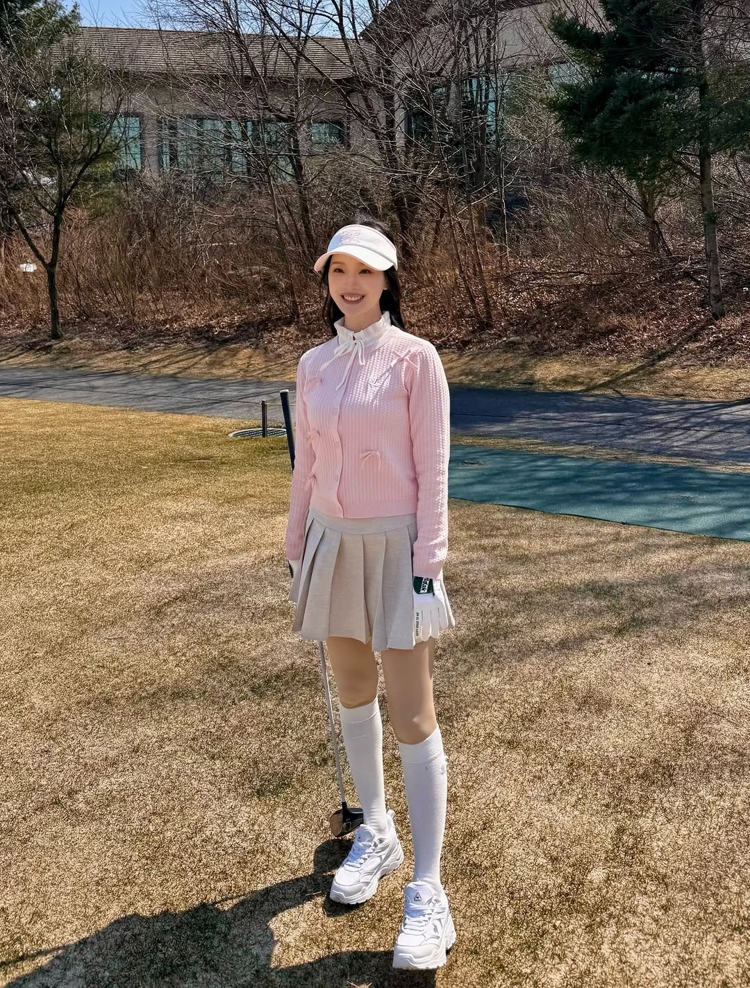 Photo shared by 💗큐트셔니 on March 27, 2026 tagging @fairliar_official. May be an image of golf, sock, turtleneck, miniskirt, beret and text.