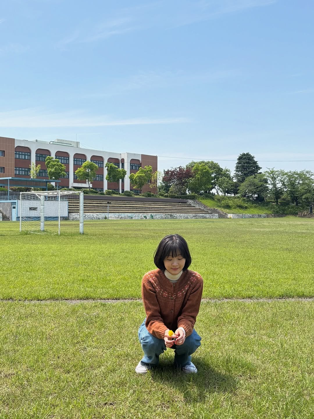 Photo by KIM DA MI on September 21, 2025. May be an image of 1 person, grass, park, picnic and text.