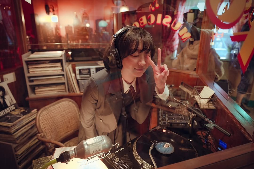 Photo by KIM DA MI on September 10, 2025. May be an image of 1 person, record player, record, stereo, telephone and text.