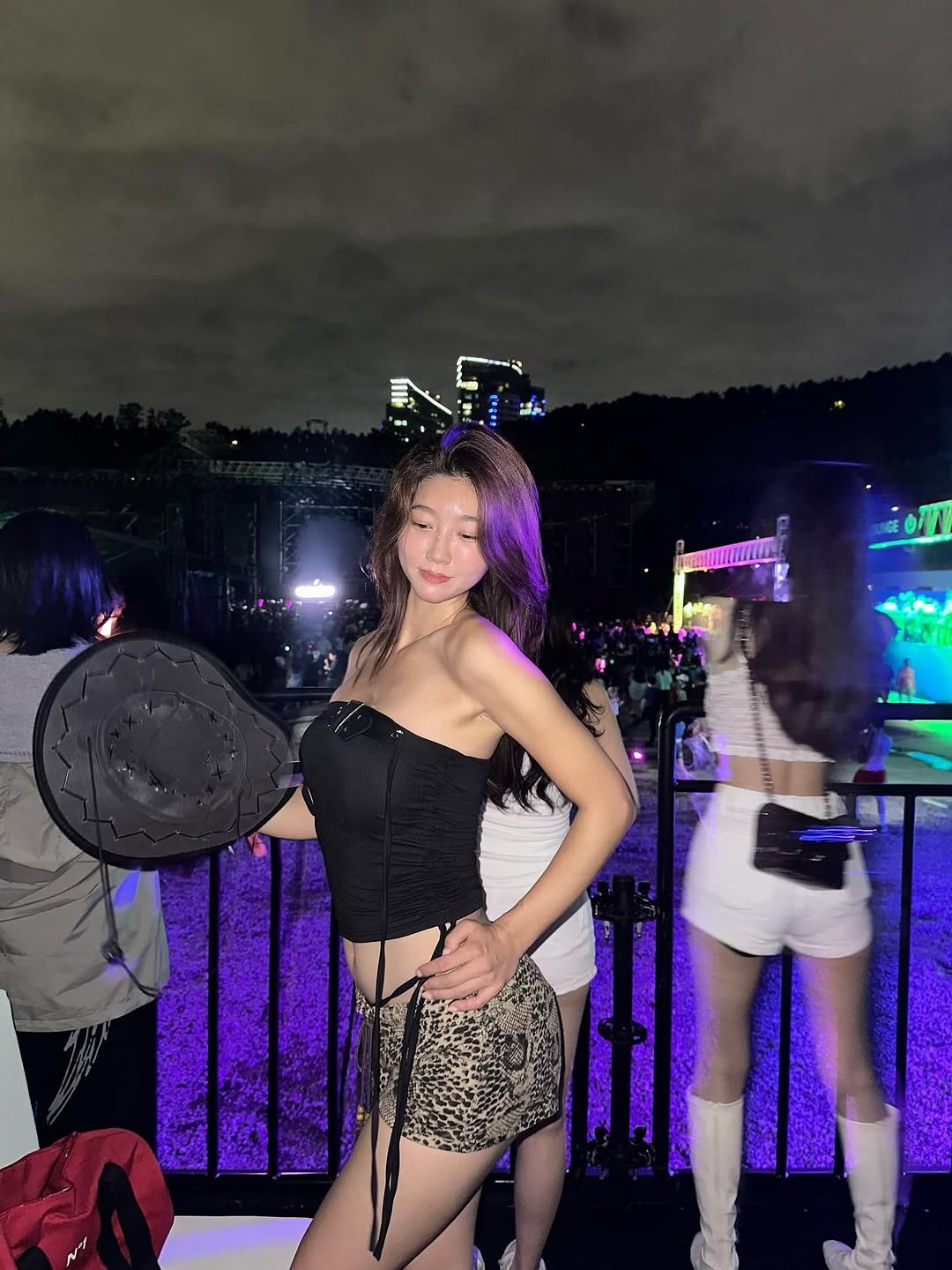 Photo shared by 𝘥𝘰𝘺𝘦𝘰𝘯 ෆ on September 21, 2025 tagging @ultrakorea. May be an image of 3 people, miniskirt, costume, fishnet stockings and text.