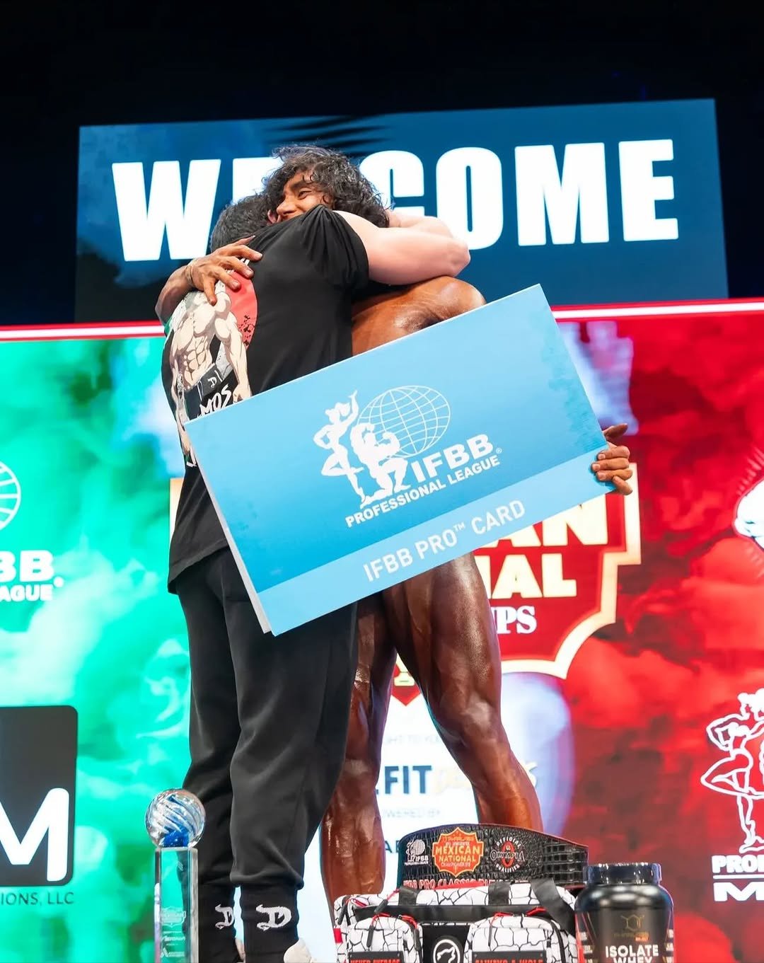 Photo shared by Daddy Aioli on November 09, 2025 tagging @gerardoreynaramos, and @dragonpharma_latino. May be an image of body building and text that says 'WE COME 4O መል B GUE L7IFBB LEAGUE PROFESSIONAL PROFESSIONAL CARD PRO AL IFBB PS PS FIT WESEO6 u ONS ONS.LLC LLC 4 (ំ IŞOLATE'.