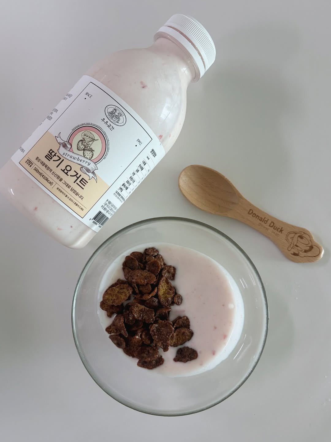 Photo shared by WHY블로거_달콤맘 on February 15, 2026 tagging @milkstorage. May be an image of granola, milk, chocolate milk, cereal, yogurt and text.