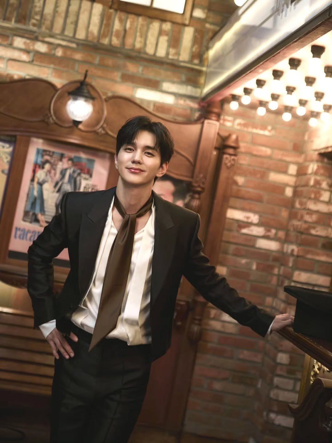 Photo shared by 유승호 on December 01, 2025 tagging @mybrown_official. May be an image of bolo tie, blazer and text.