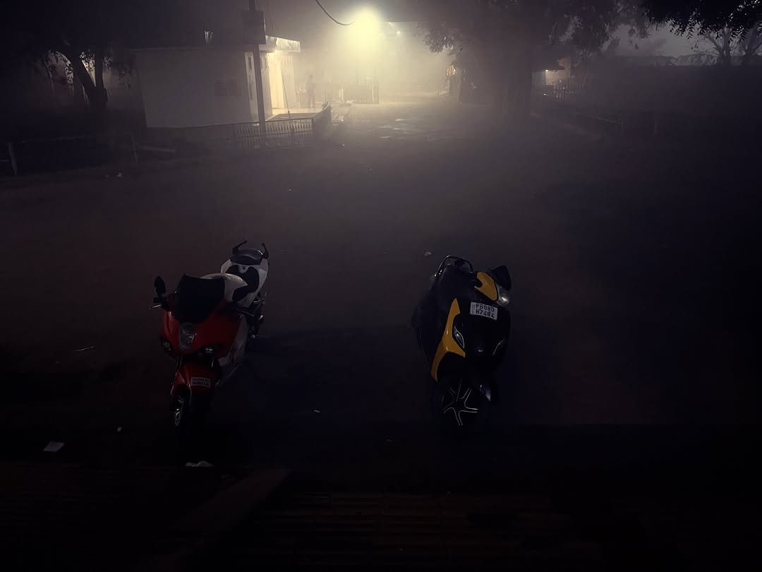 Photo by Rajveer on January 16, 2026. May be an image of motorcycle, scooter, fog, road and text.