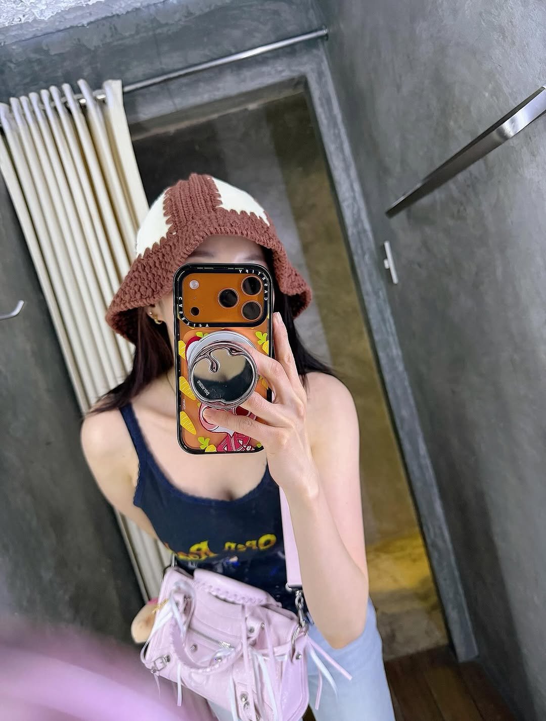 Photo by Sandara Park on March 31, 2026. May be an image of hat, phone, mirror, sling, top and text.