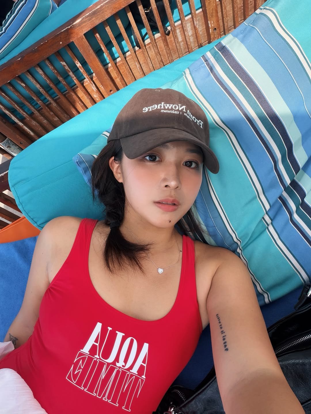 Photo shared by 김 다혜 / Dahye kim on April 02, 2026 tagging @from.nowhere.official. May be an image of hat, deck chair and text.