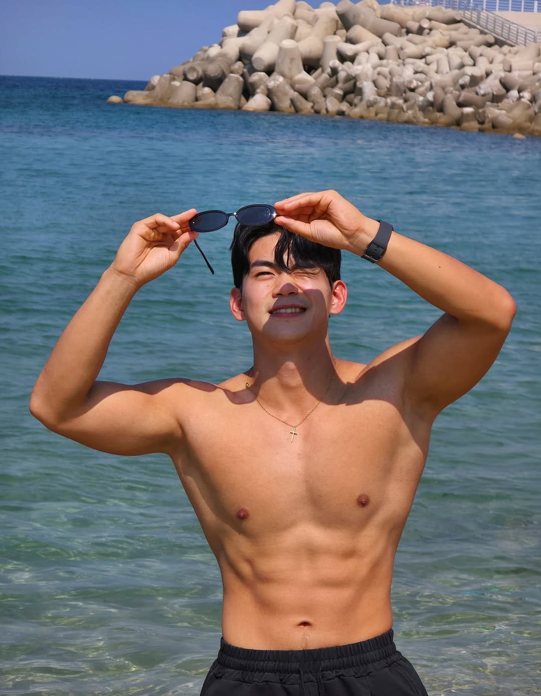 Photo by 김병수 on September 12, 2025. May be an image of 1 person, biceps, body building, underwear, beach, ocean and text.