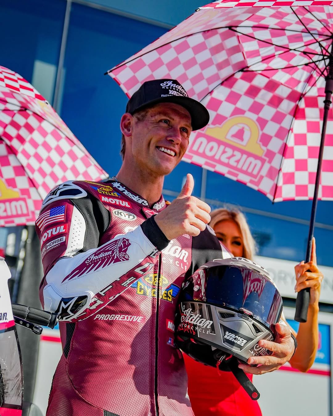 Photo shared by Daytona International Speedway on March 07, 2026 tagging @troyherfoss17, and @motoamerica. May be an image of racing vehicles, parasol, helmet, umbrella and text.