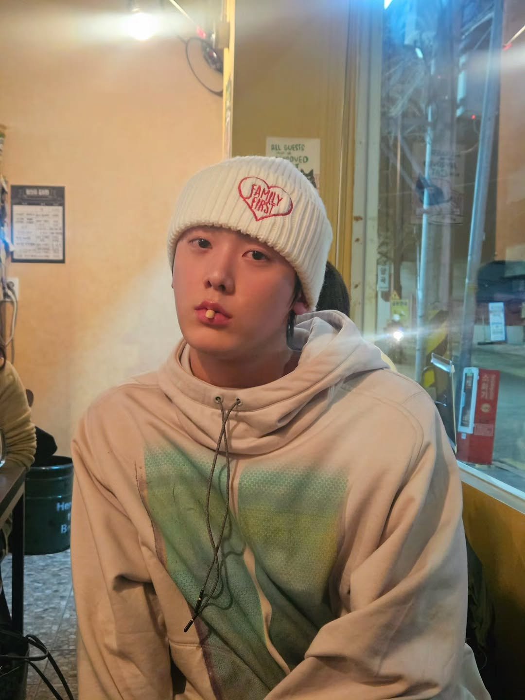 Photo by 윤산하 on February 21, 2026. May be an image of one or more people, bangs, hat and text.