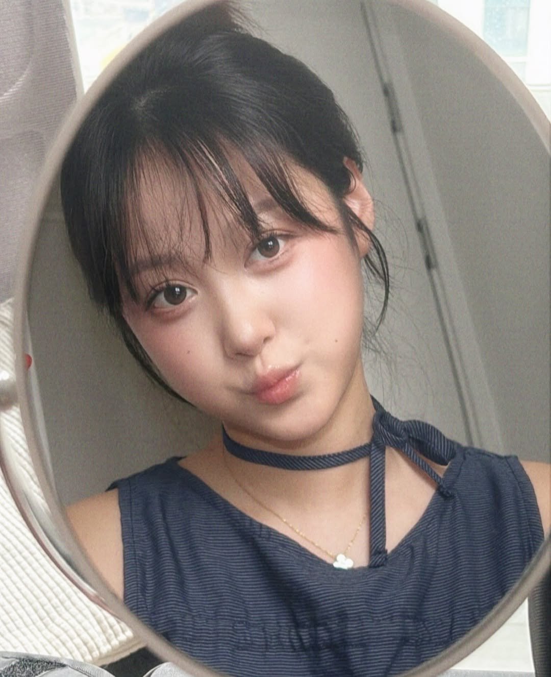 Photo by 또비니 DDOBINI on July 31, 2025. May be a selfie of 1 person, bangs, choker, mirror and text.