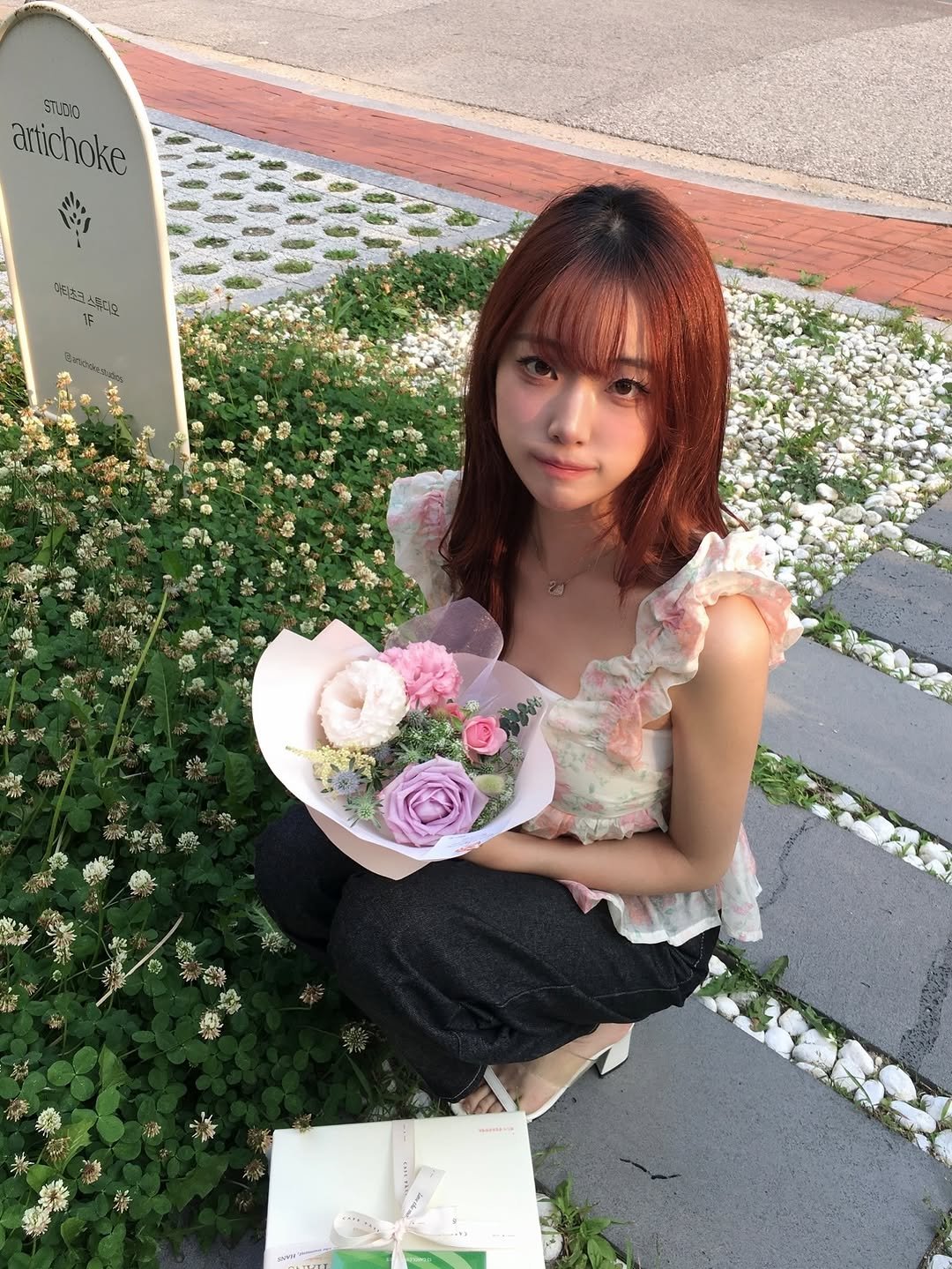 Photo by Hee on July 10, 2025. May be an image of 1 person, hair, prairie gentian, baby's-breath, white lily, carnation, rose and text.