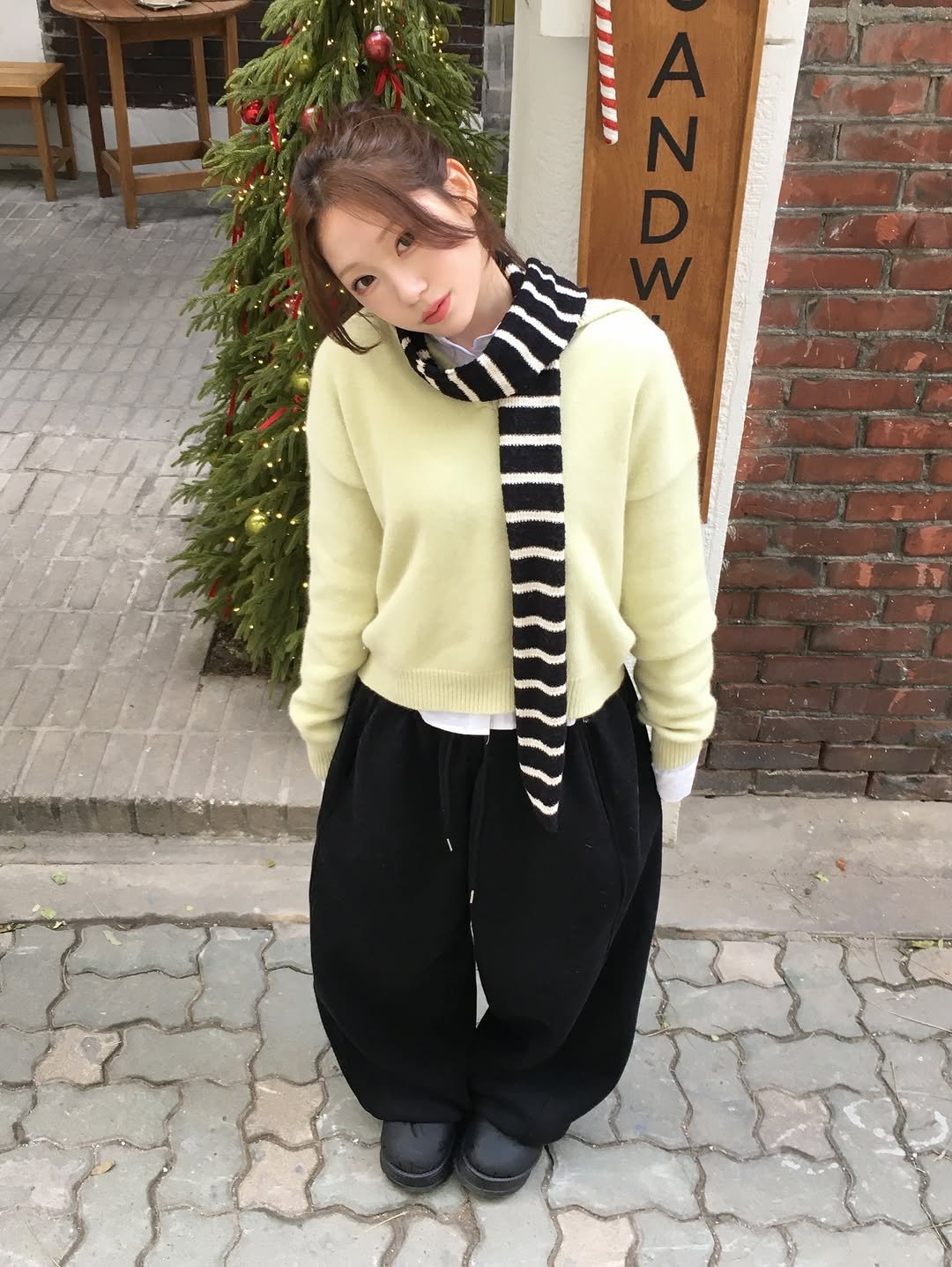 Photo by 정연 on December 23, 2025. May be an image of duffle coat, sweater, parka, turtleneck, cardigan and text that says 'A N D N'.