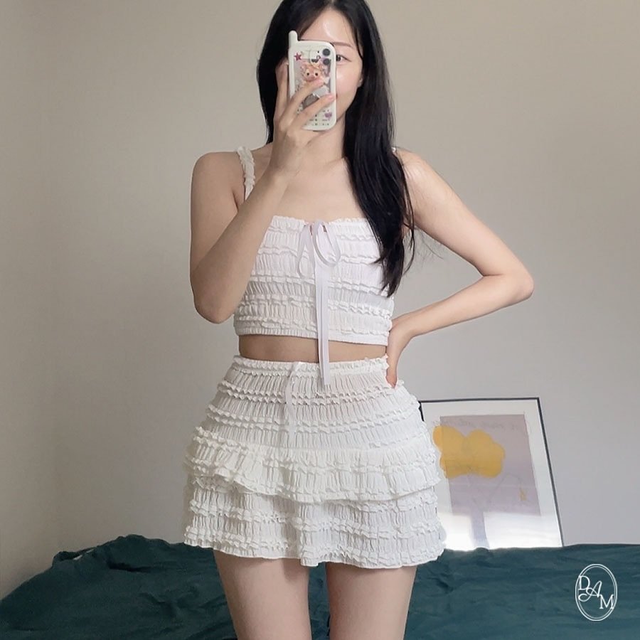 Photo by 디어앤무드: 비키니 비치웨어🎀 on September 28, 2025. May be an image of skirt, top, dress, shorts, miniskirt and text.