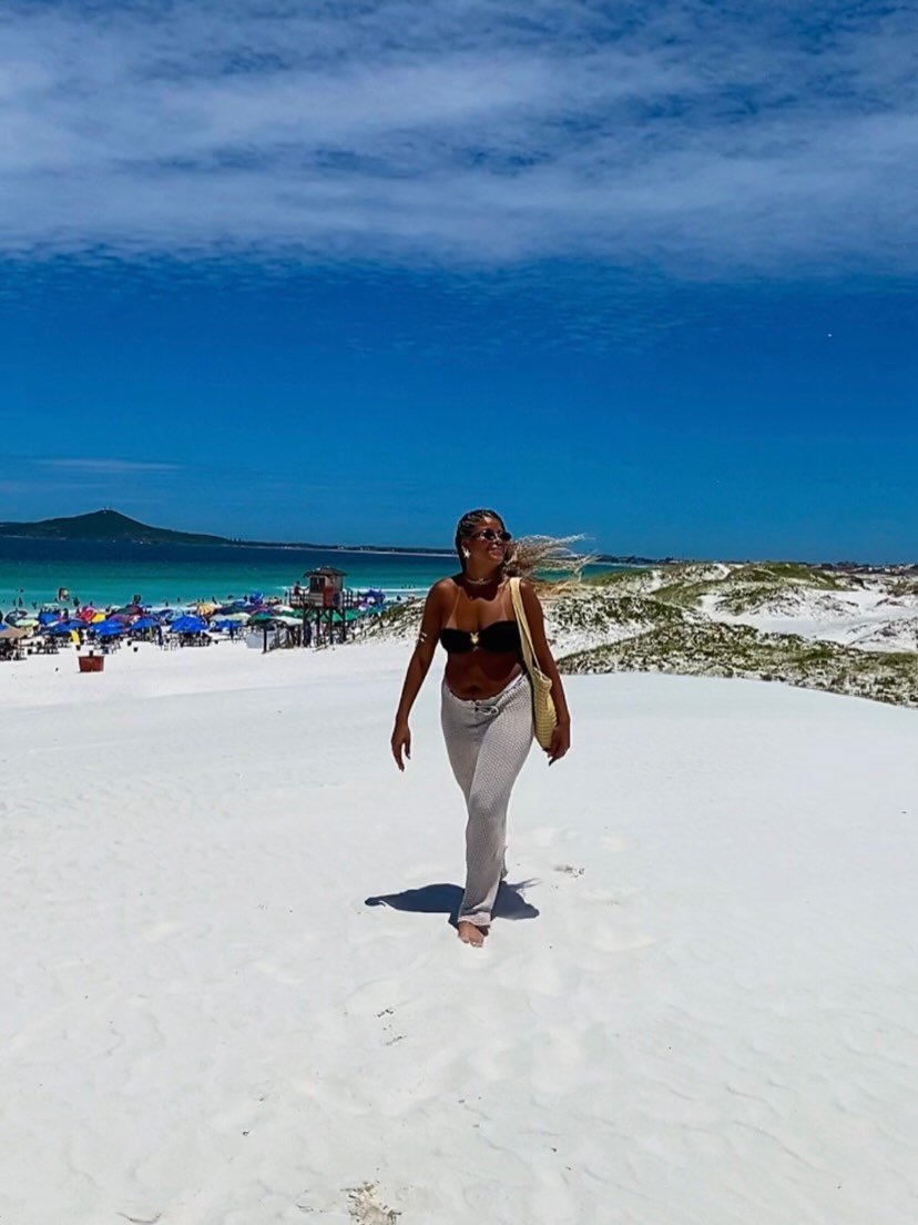 Photo by ARIANA RIBEIRO |🇧🇷 on February 17, 2026. May be an image of sarong, beach, ocean and text.