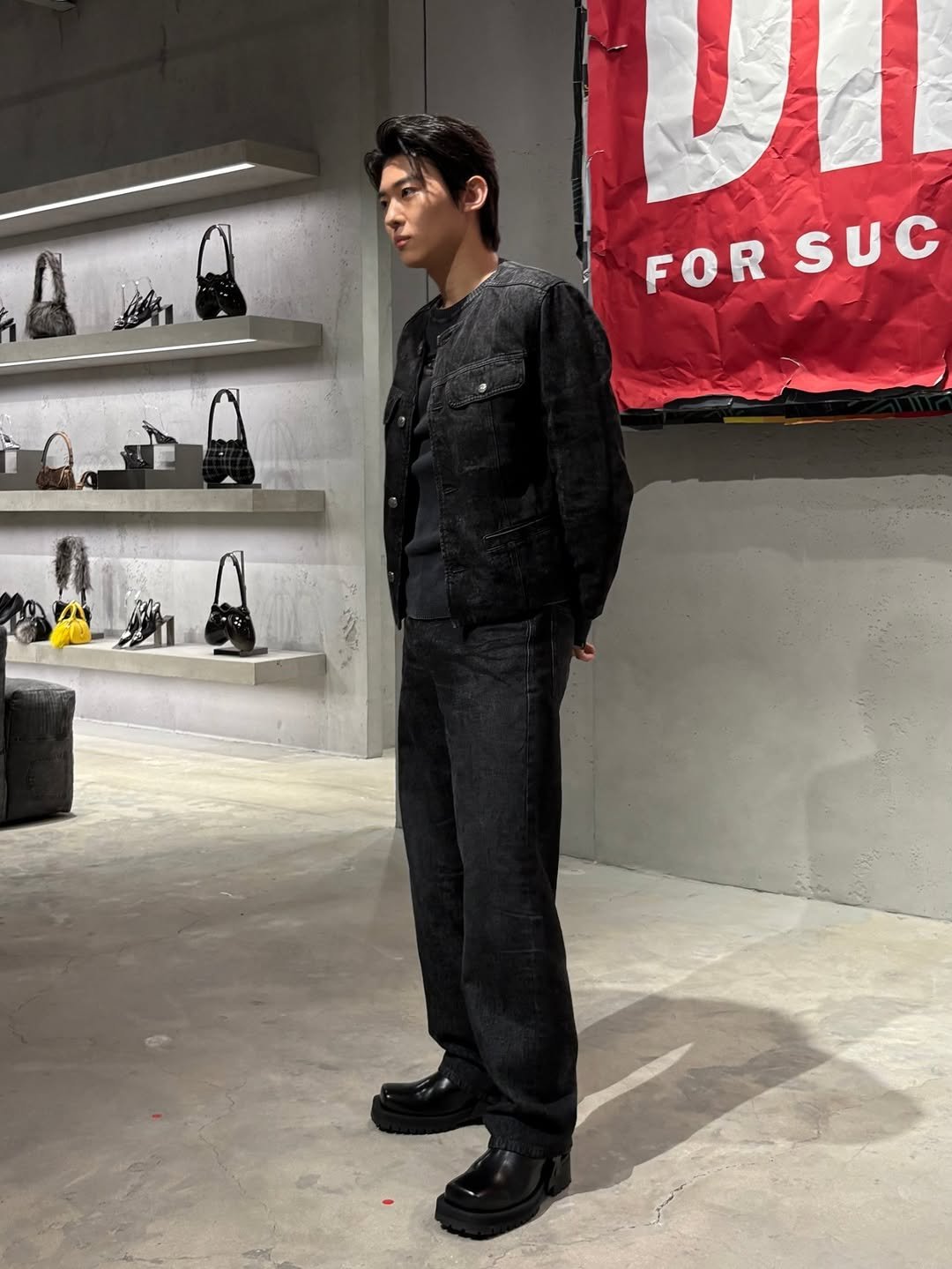 Photo shared by DEX / 김진영 on October 17, 2025 tagging @diesel. May be an image of boots, toecap shoes and outerwear.