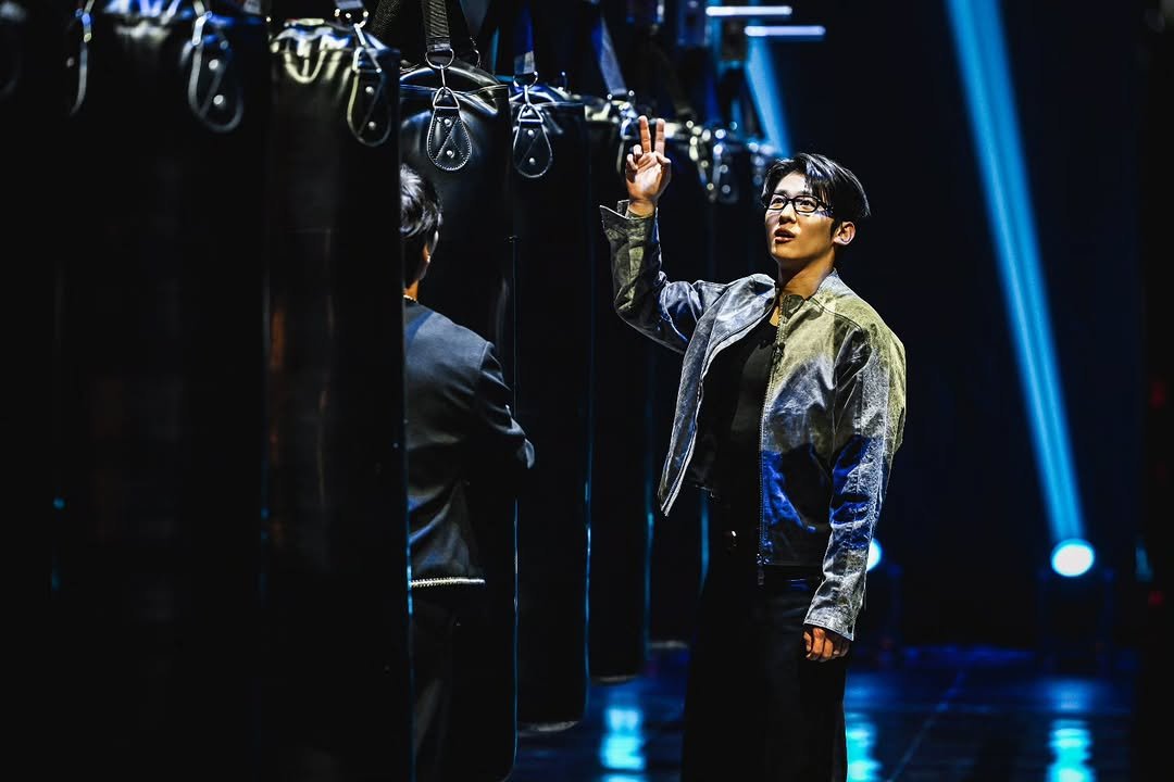 Photo by DEX / 김진영 on November 28, 2025. May be an image of one or more people, bangs, top, concert and text.