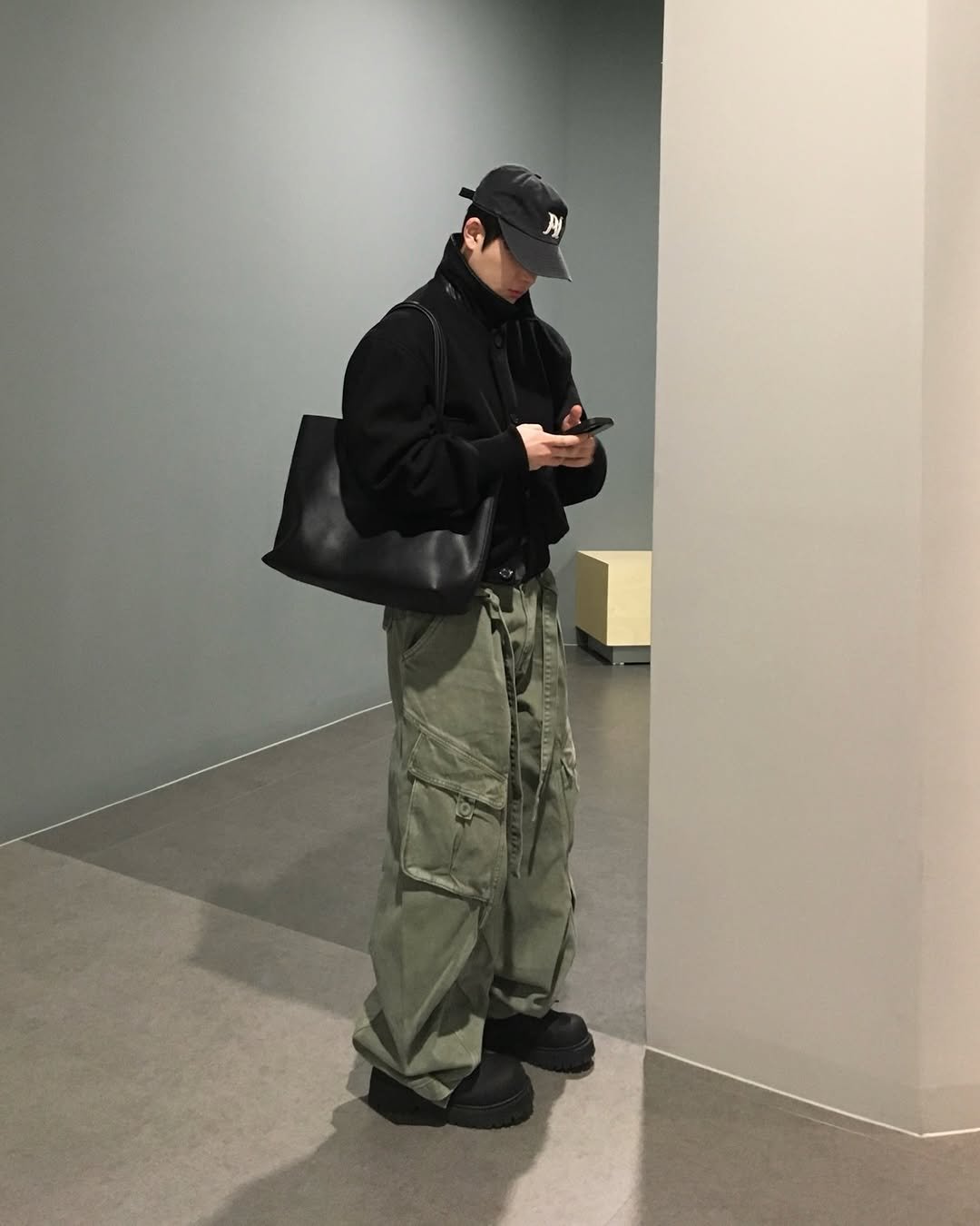 Photo by 도형, 디멘트 DMENT on February 05, 2026. May be an image of standing, military uniform, sling, parka and text.