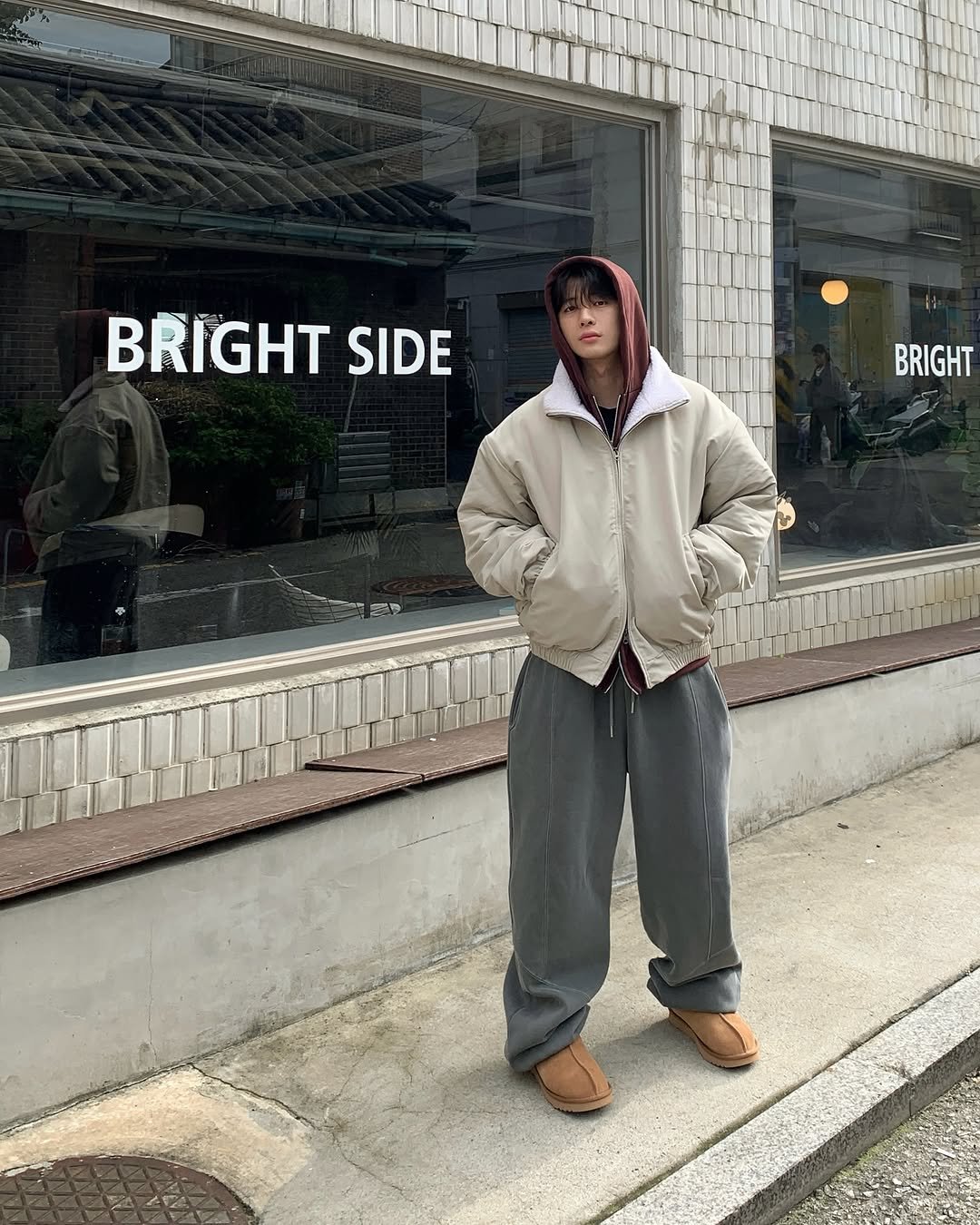 Photo by 도형, 디멘트 DMENT on October 21, 2025. May be an image of duffle coat, raincoat, parka, sweatpants and text that says 'BRIGHT SIDE BRIGHT'.