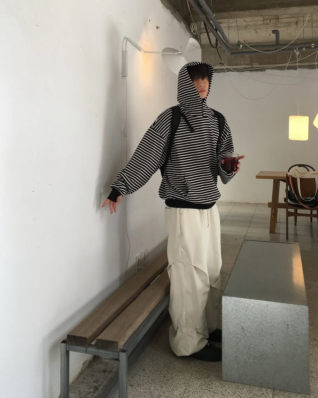 Photo by 도형, 디멘트 DMENT on September 11, 2025. May be an image of 1 person, duffle coat, top, stripes, turtleneck, sweatpants, parka and text.
